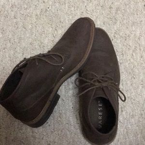 A pair of brown low cut boots.